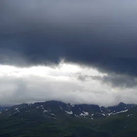 Dark clouds forming over Piz Champatsch in the Lower Engadin, Switzerland