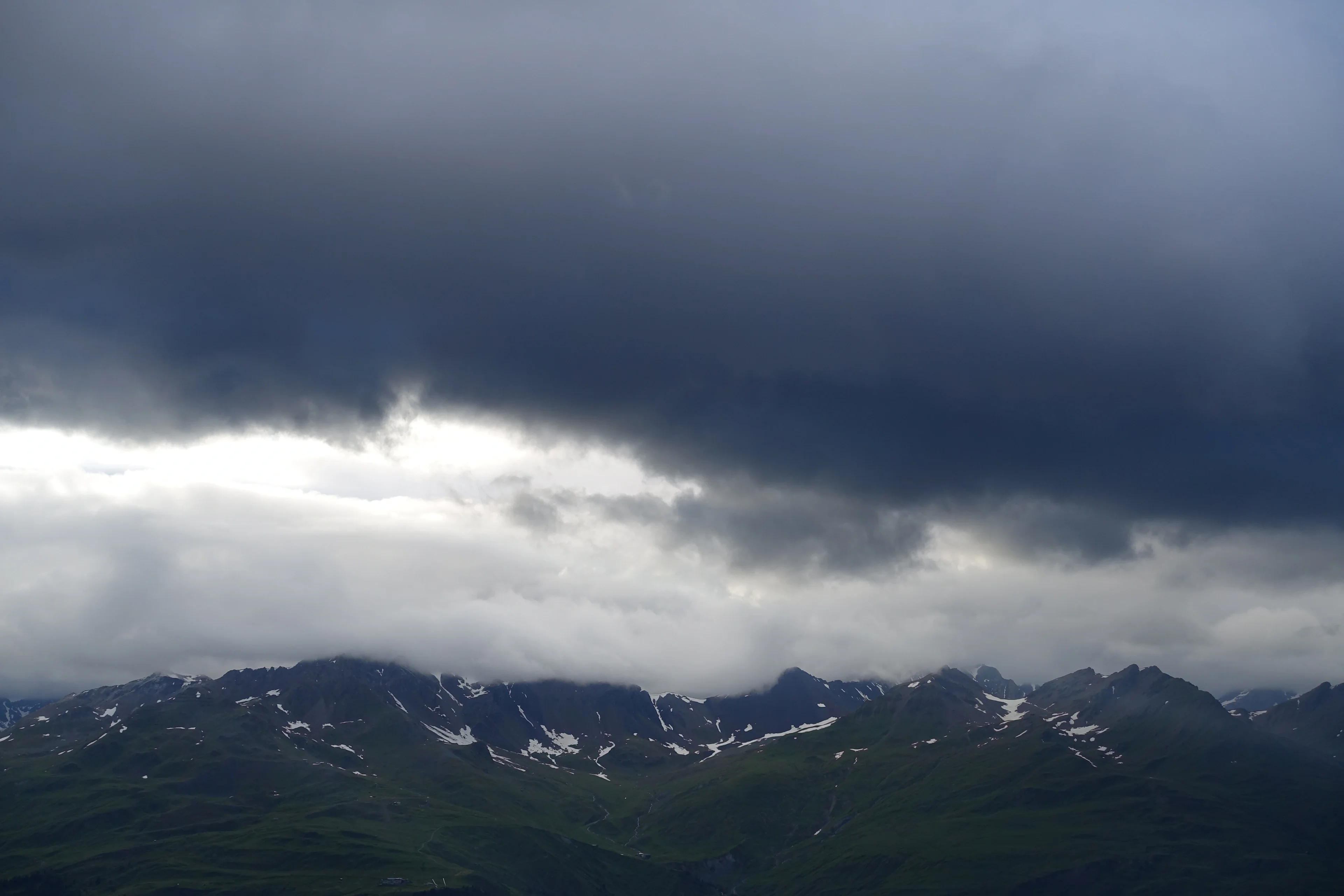 Dark clouds forming over Piz Champatsch in the Lower Engadin, Switzerland