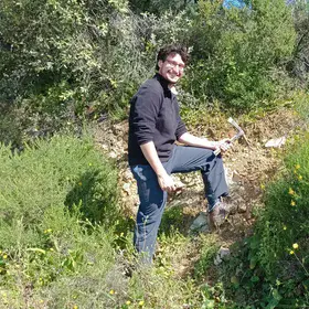 Soil scientists in action: Juan discovering granodiorites