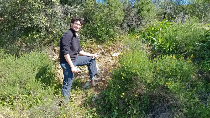 Soil scientists in action: Juan discovering granodiorites