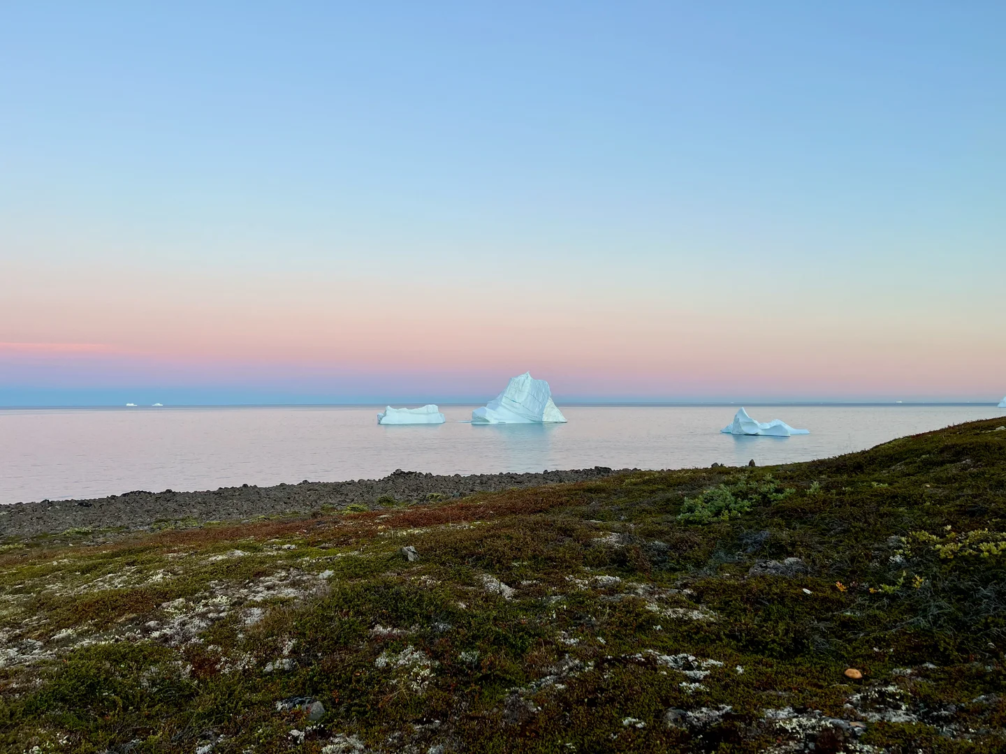 Tranquil Horizons: Iceberg's Journey at Sunset