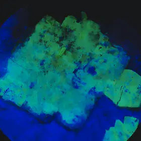 Torbernite flakes from les Bois Noirs, France