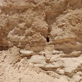 An Original Outcrop of Sedimentary Bedding with Weathering Gaps and Holes