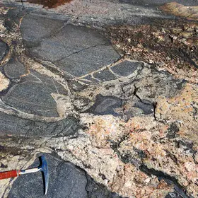 Amphibolite enclaves crossed by two generations of granitic veins