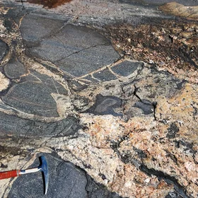 Amphibolite enclaves crossed by two generations of granitic veins