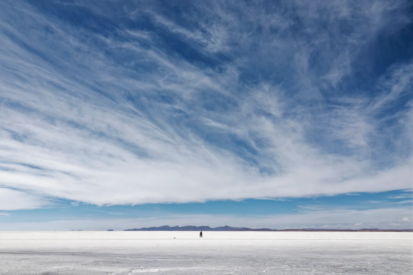 A Couple under the Clouds at Salar de Uyuni