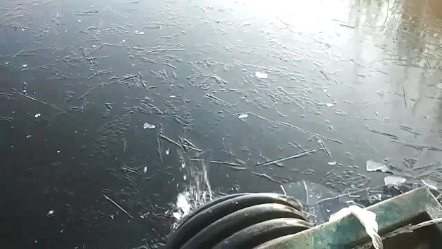 Icy lake and journey to sediment sampling  point