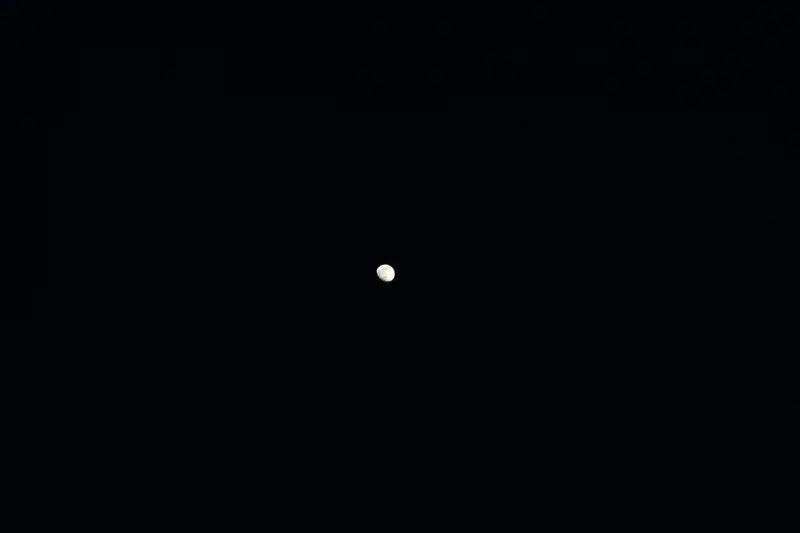Gibbous moon in a dark sky