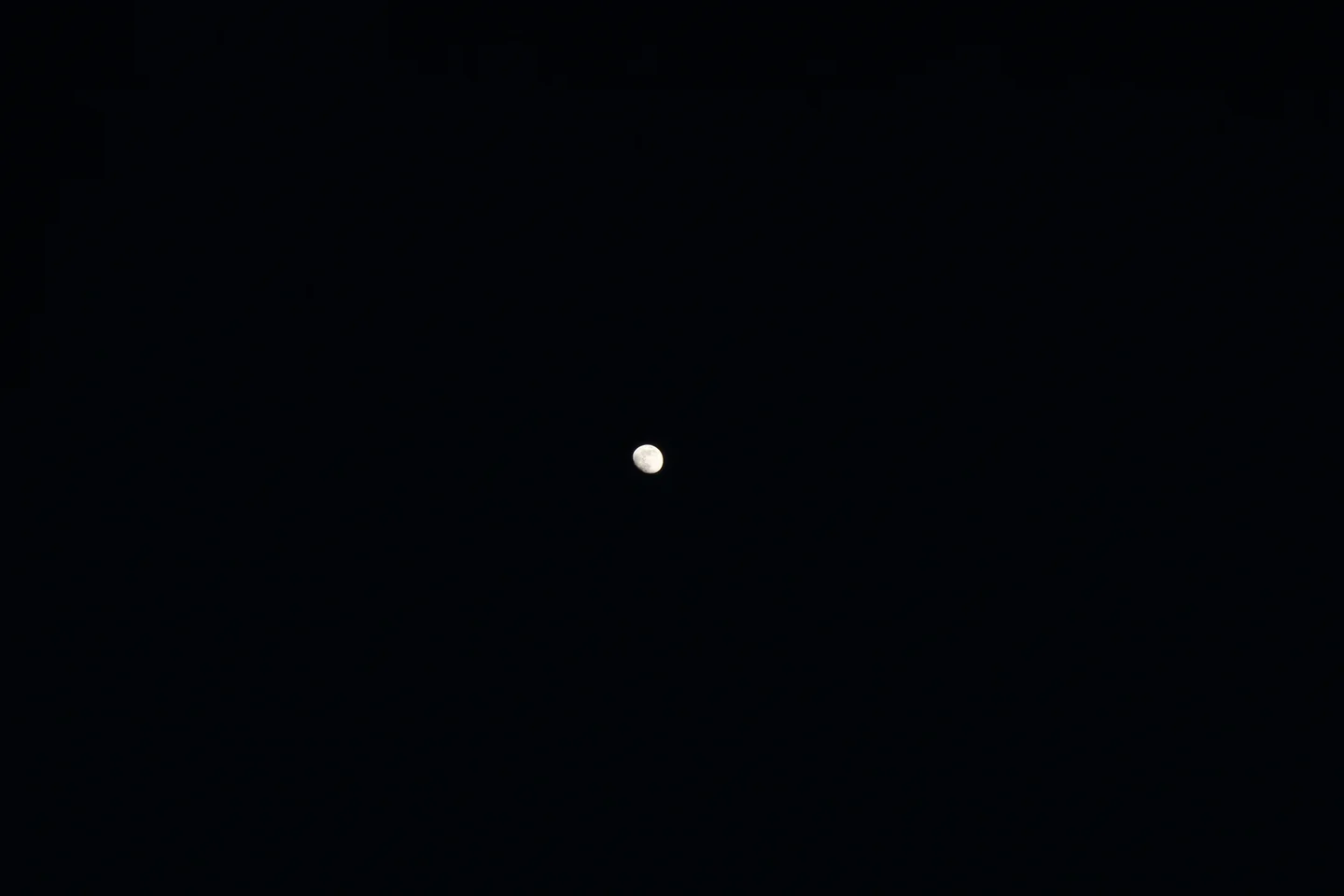 Gibbous moon in a dark sky