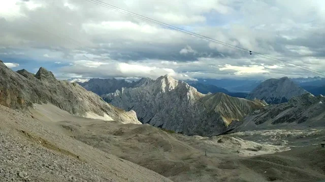 Timelapse video of layers of clouds passing over the Alpine range