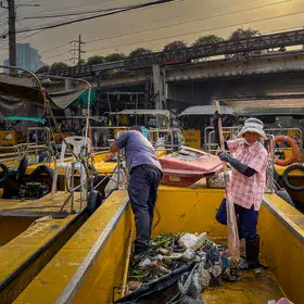 Lady preparing for River Clean-up on the Chao Phraya River, Bangkok