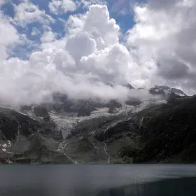 Katora Lake under Rising Clouds and Melting Ice