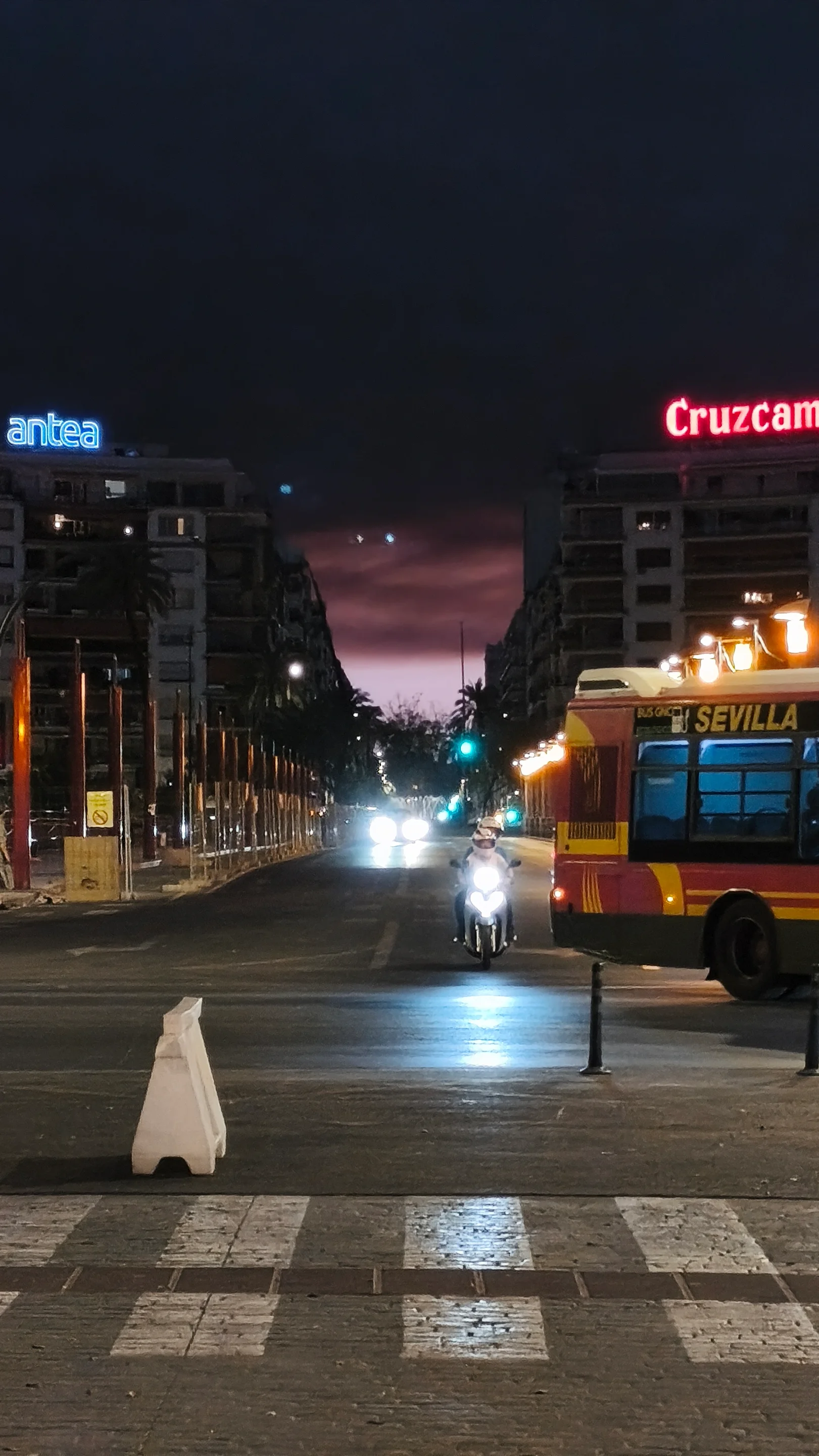 Sunset over Seville with pink, violet and reddish tones caused by smoke from the Niebla wildfire, about 60 km away.
